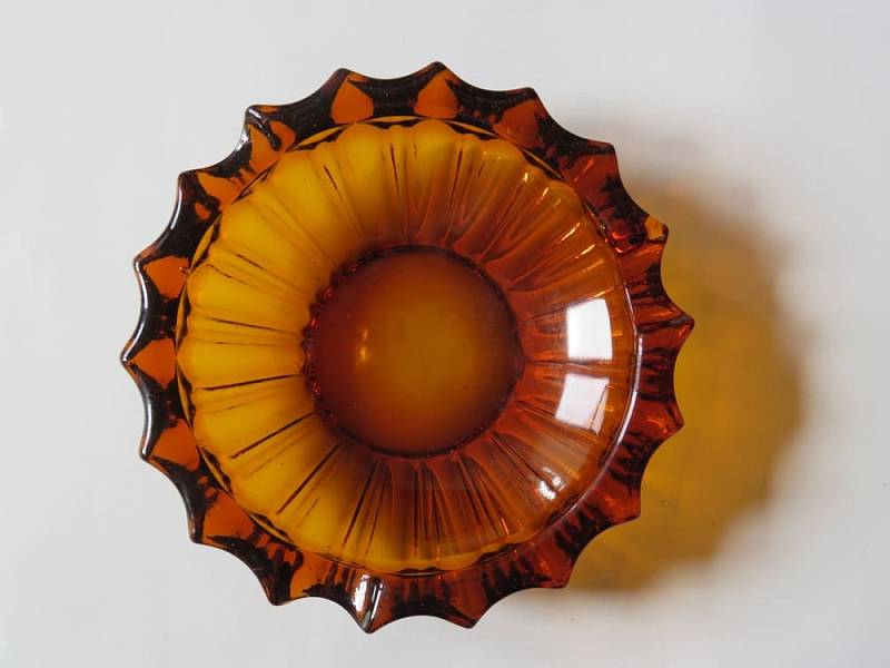 An,Ashtray,Of,Brown,Glass.