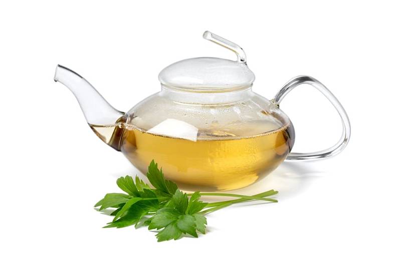 Glass,Teapot,With,Lovage,Tea,And,A,Fresh,Twig,Of